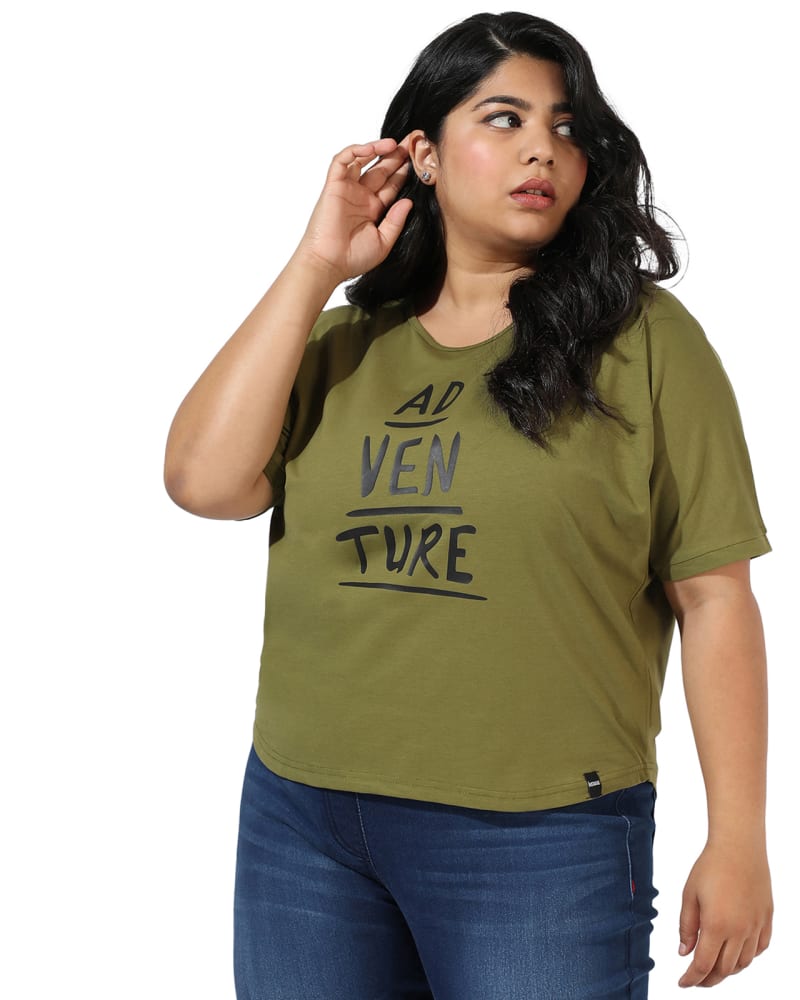 Front of a model wearing a size 5XL Olive Green "Adventure" Text Print Tee in Olive Green by Instafab Plus. | dia_product_style_image_id:298036
